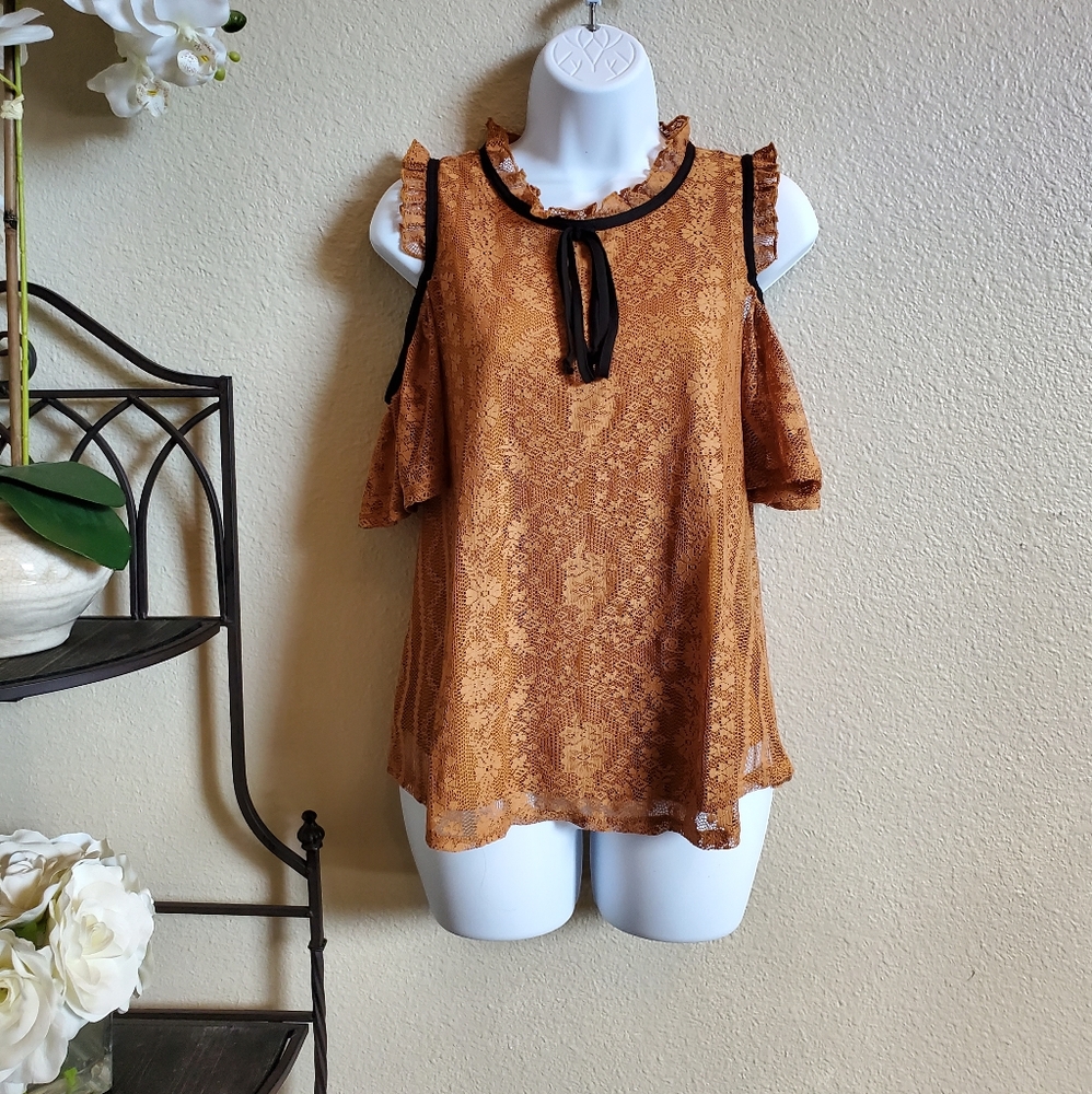 Cold shoulder blouse.